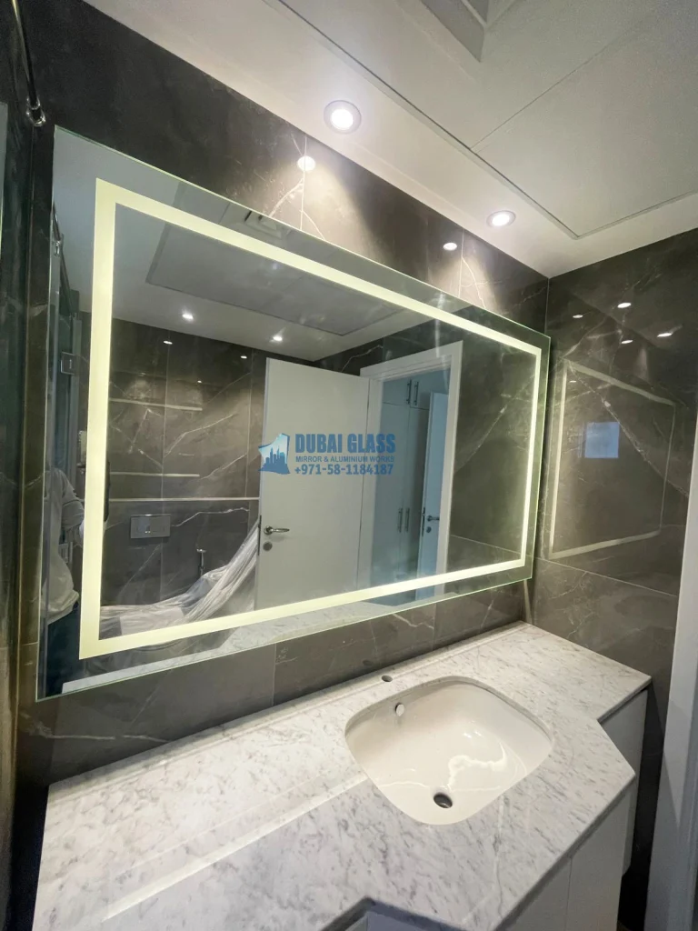 Professional Backlit Wall Mirror Installation in Dubai, offering modern lighting and sleek design.
