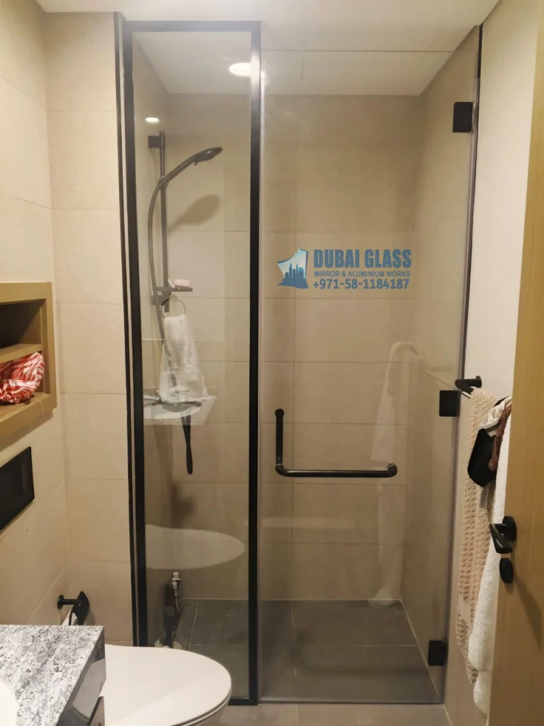 Full-height swing shower enclosure with black frame Dubai by Dubai Glass Works
