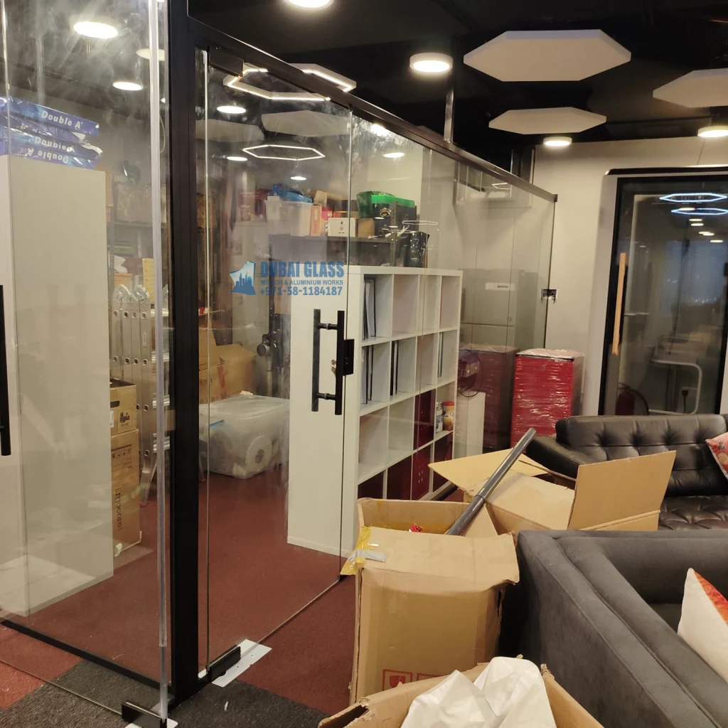 black-framed low-height office glass divider