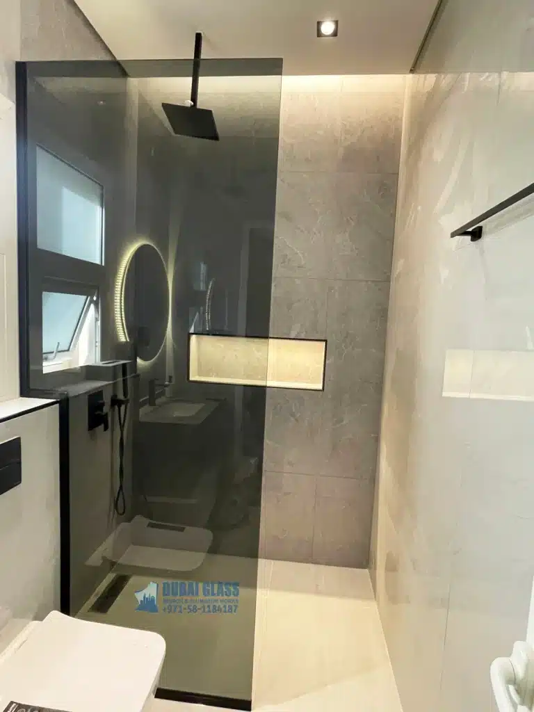 black glass shower screen with black frame