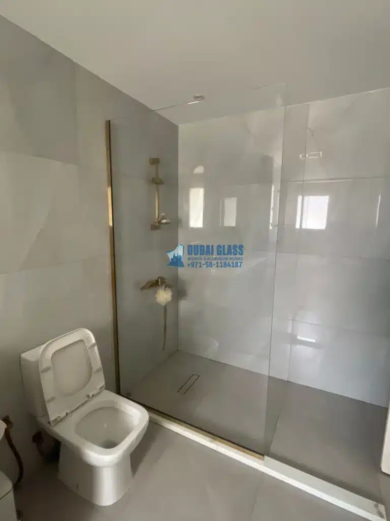 gold-framed shower screen fitting