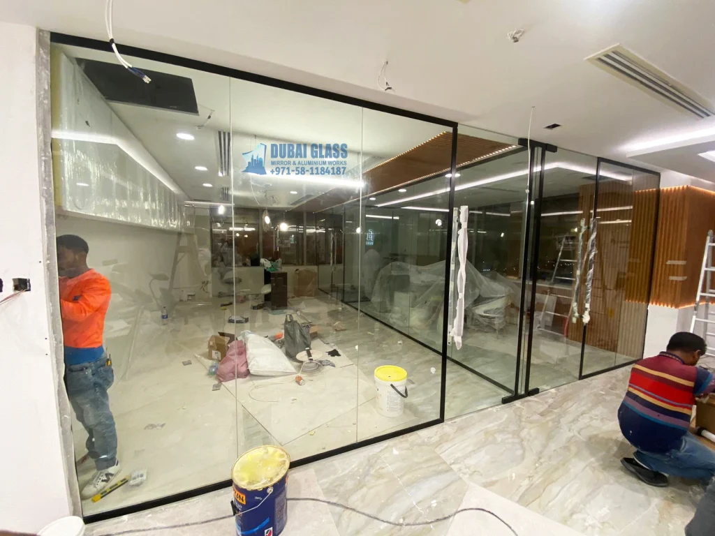 Black Frame Aluminium Office Partition with Clear Tempered Glass, providing a sleek, professional look and durability