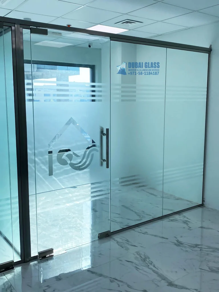 Black Frame Low Height Glass Partition in Dubai, UAE, offering a modern, open feel with clear glass.