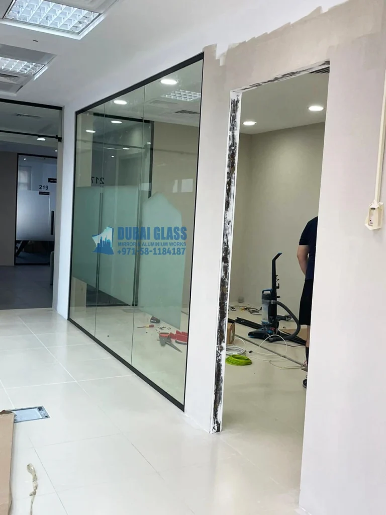 Black Frame Office Glass Partition, offering modern design and privacy with clear glass panels.