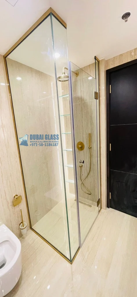 Full-height corner shower glass partition with gold matte finish