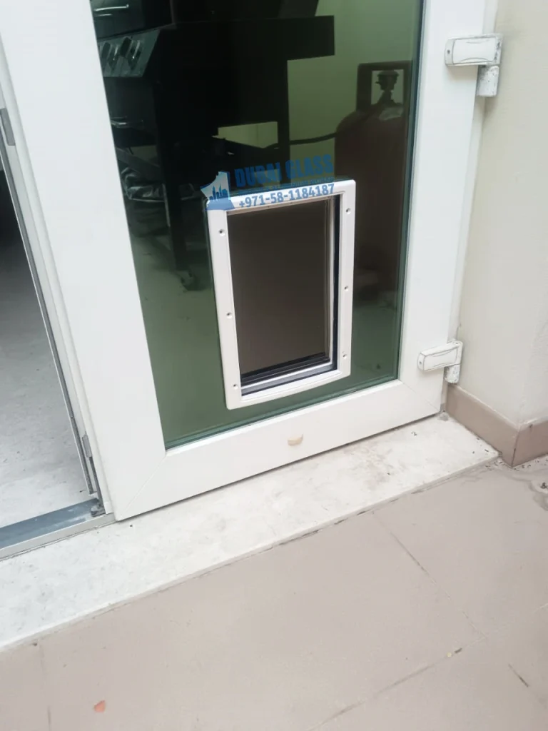 Dog flap frame in aluminium door Dubai – Dubai Glass Works