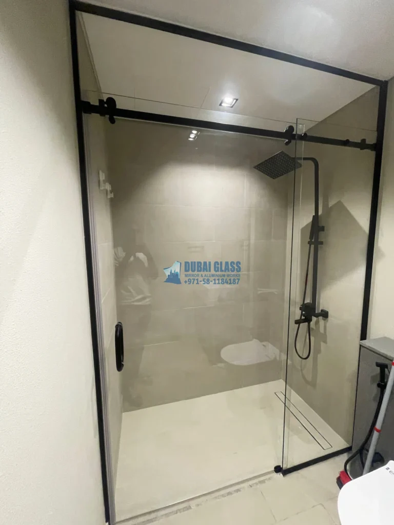 Full-height sliding shower enclosure with large door Dubai by Dubai Glass Works