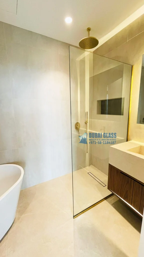 fixed shower screen with gold mirror frame dubai