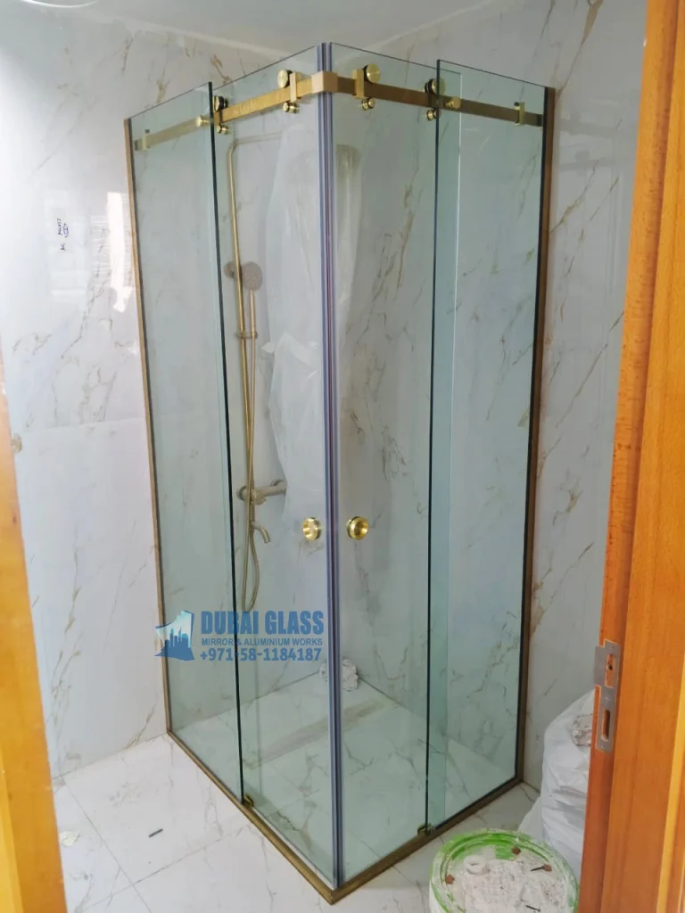 corner shower glass partition with gold matte frame