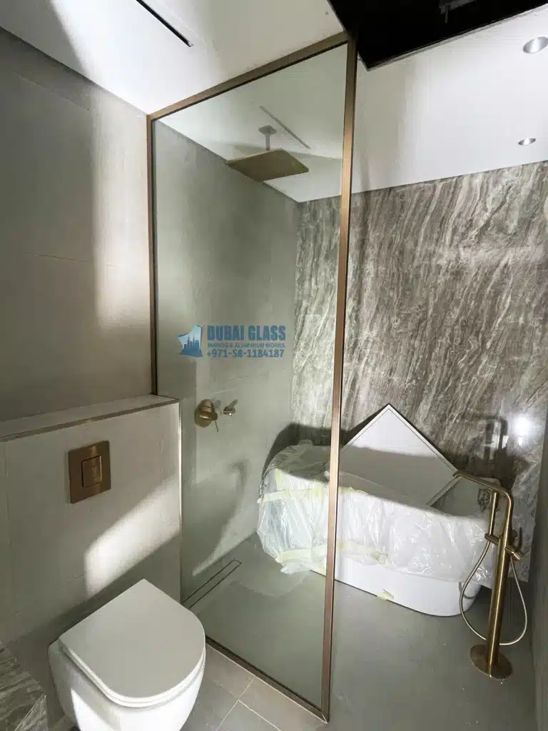 gold matte framed shower screen installation